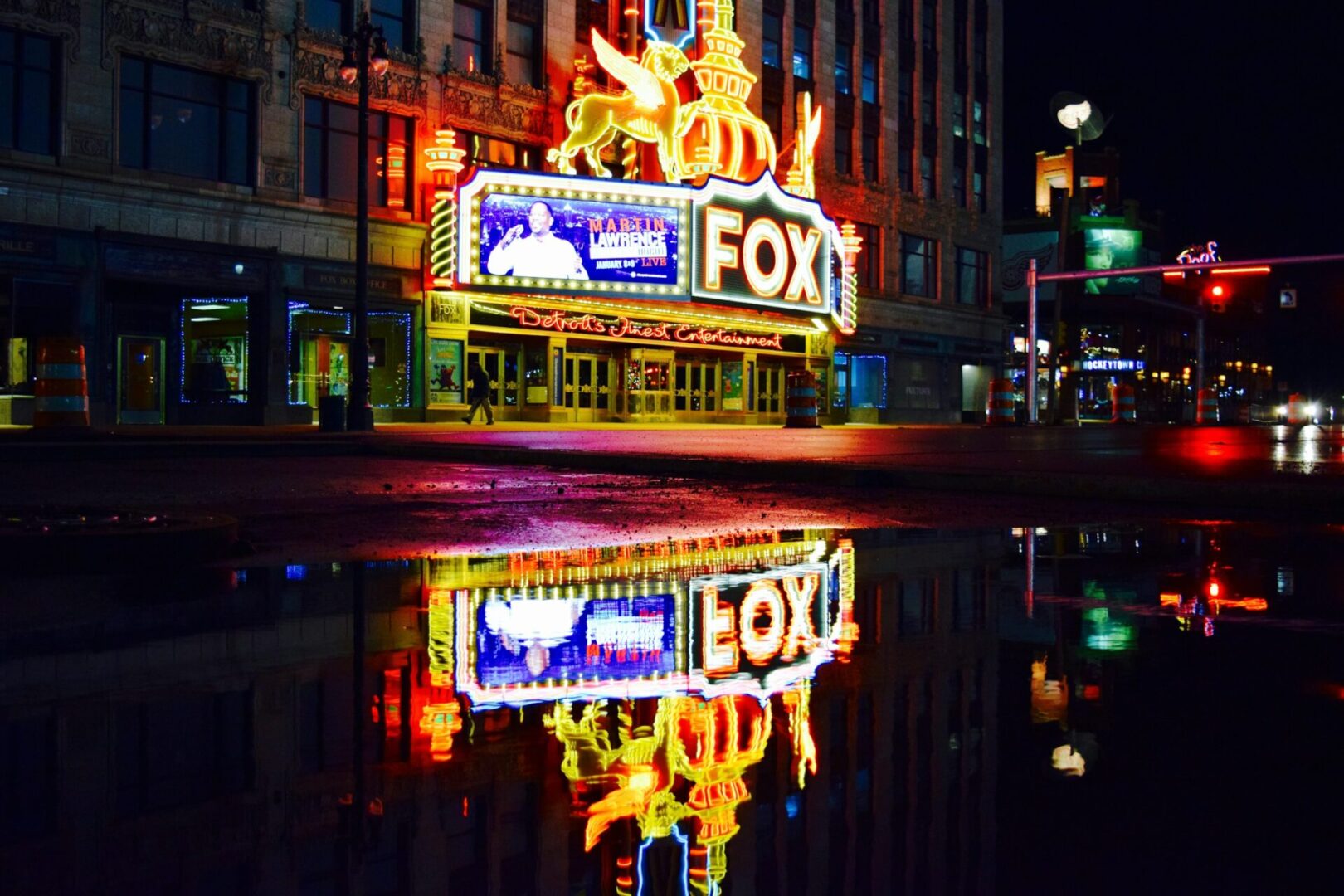 A reflection of the fox theater in water.